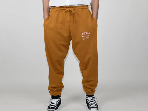 SUPPLEMENT TRACK PANT. OAK MUSTARD